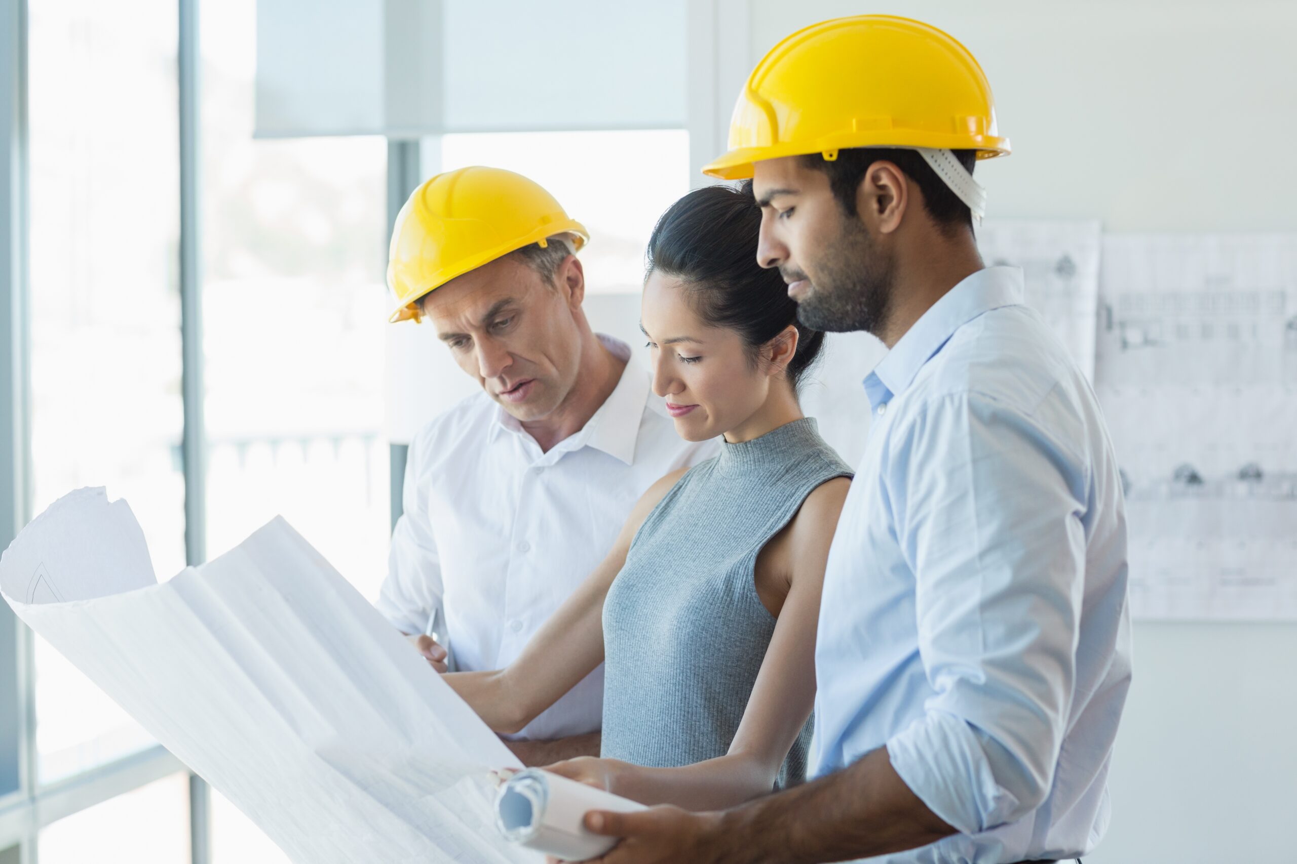 construction architects looking over plans